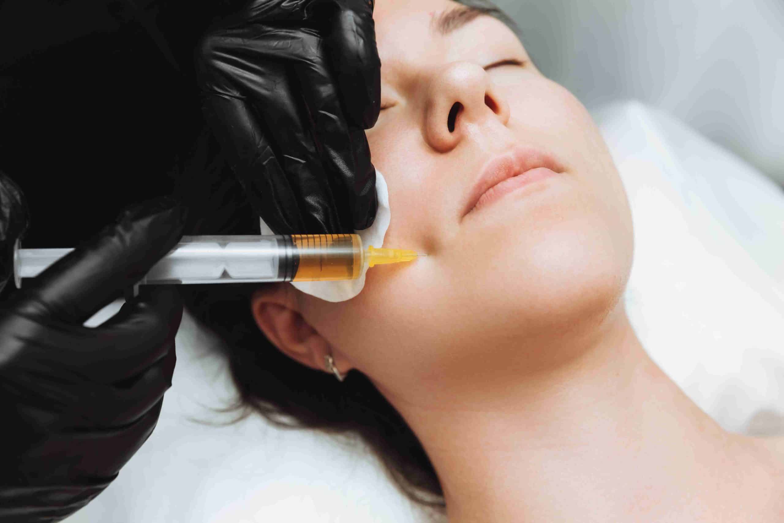 Closed Eyes Woman Receiving PRF Injection | Noble Clinic in Draper, UT
